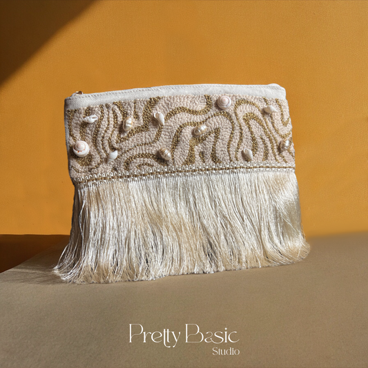 Golden Shells hand tufted clutch