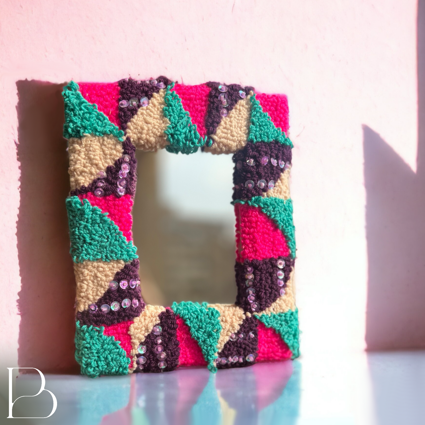 Bejeweled triangles hand tufted mirror