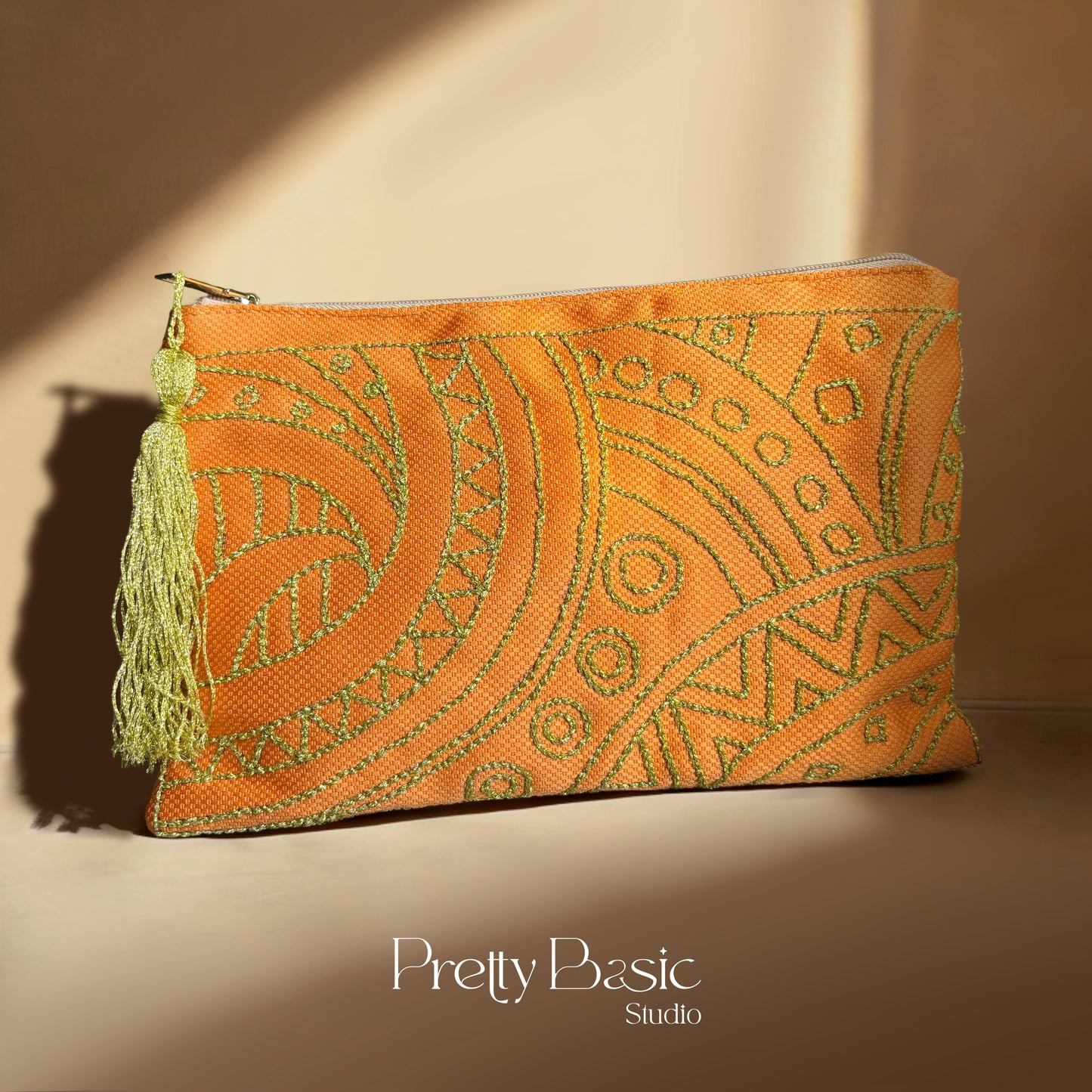 Gold twirls Hand Tufted Clutch