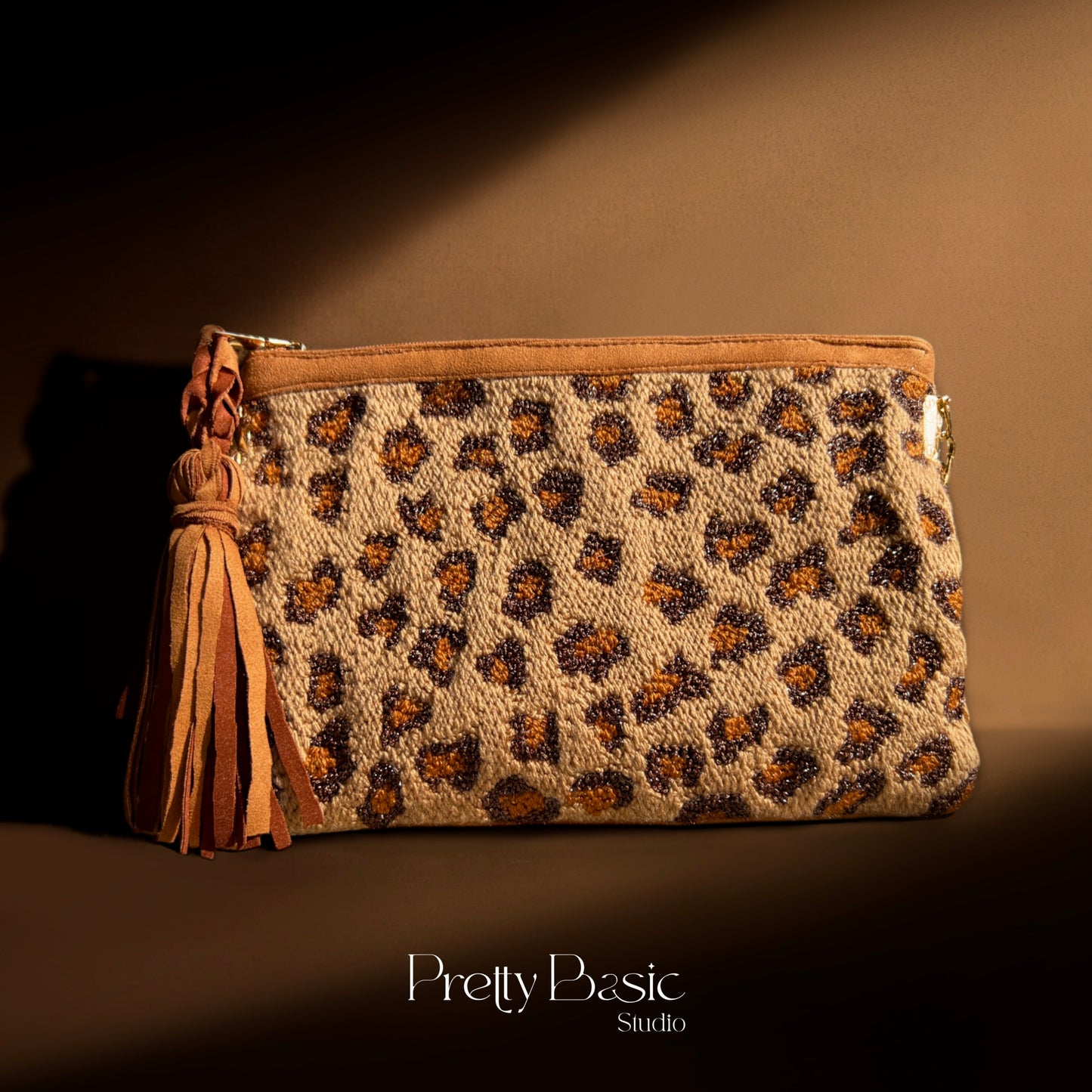 Cheetah hand tufted clutch