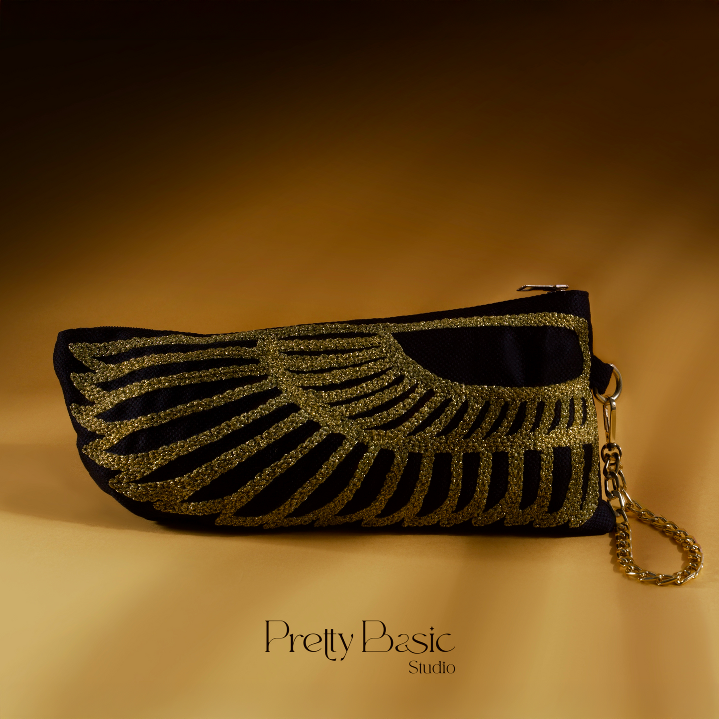 The Golden wing hand tufted clutch